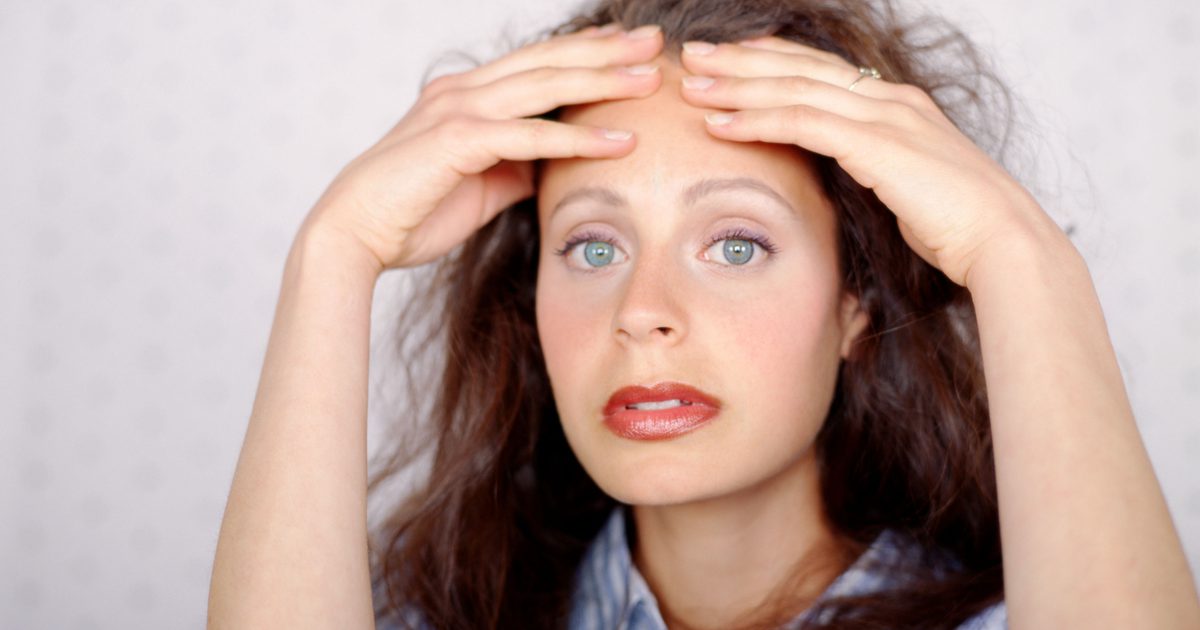 Rugpijn, kramp, spotting en hoofdpijn 2 dagen voor een menstruatie