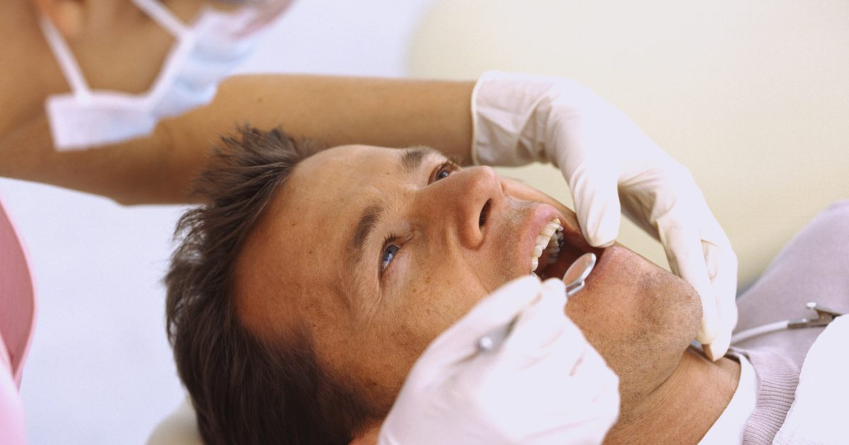Tecken på cancer i munnen eller tandköttet